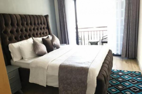 serenity suites apartment with private parking space,modern equipped gym,heated swimming pool and a relaxing rooftop with unbeatable city views
